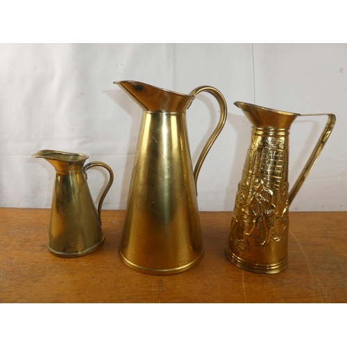 252 - A pair of vintage J S & S brass water jugs and another.