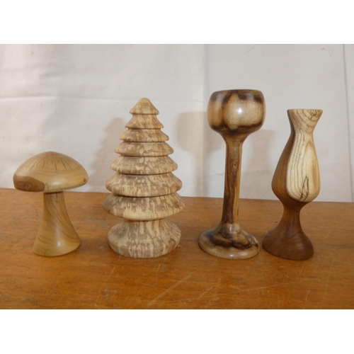 254 - A collection of wood turned items, to include a mushroom, tree & more.