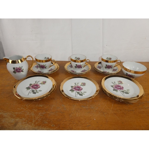 182 - A vintage rose patterned and gilt tea set.