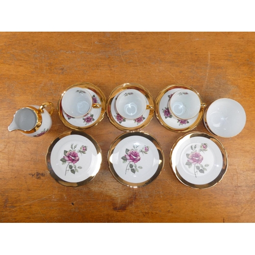 182 - A vintage rose patterned and gilt tea set.