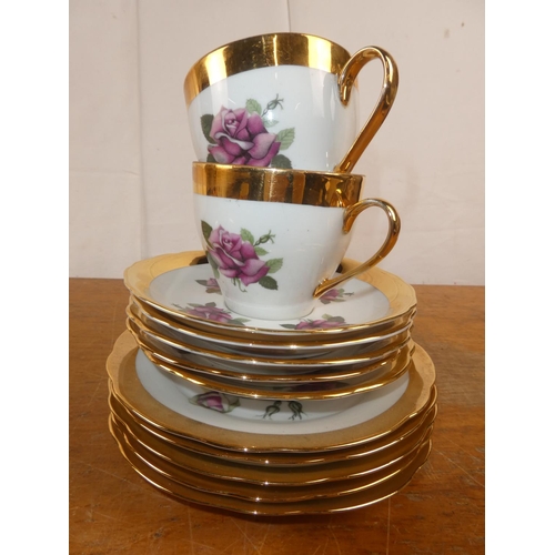 182 - A vintage rose patterned and gilt tea set.