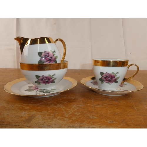 182 - A vintage rose patterned and gilt tea set.