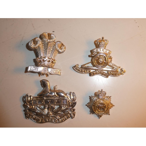 200 - An assortment of military and police badges.