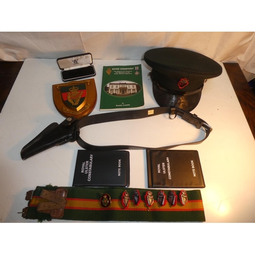 235 - A collection of R.U.C & UDR items to include leather pistol holster, cap, plaque & book etc.