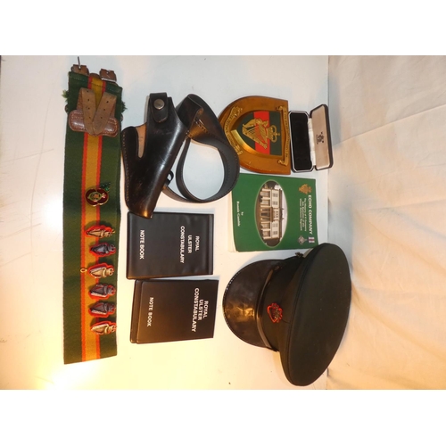 235 - A collection of R.U.C & UDR items to include leather pistol holster, cap, plaque & book etc.