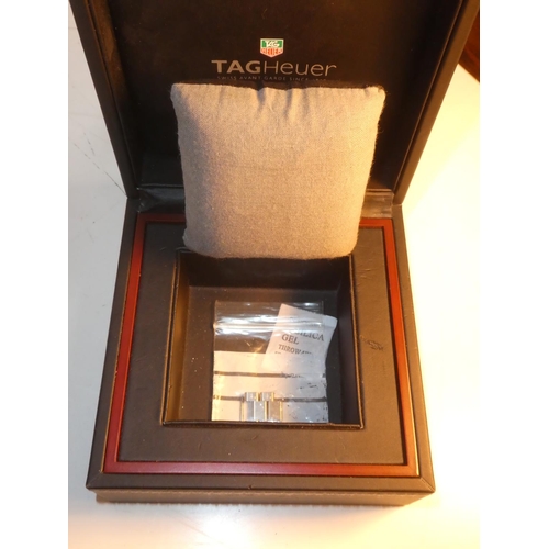 99 - A Tag Heuer carbon fibre watch from the Formula 1 collection, complete with original box and paper.