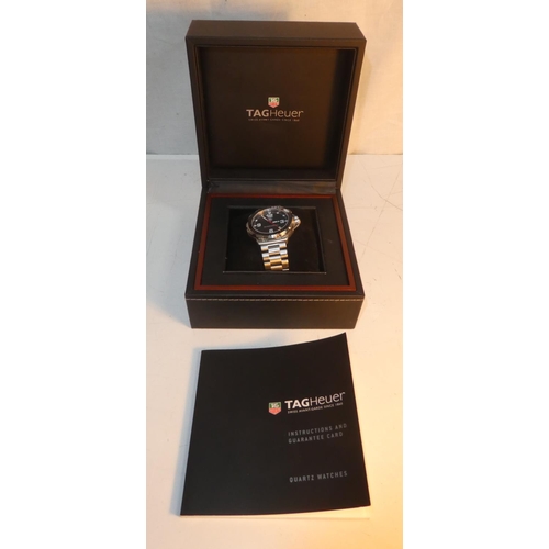 99 - A Tag Heuer carbon fibre watch from the Formula 1 collection, complete with original box and paper.