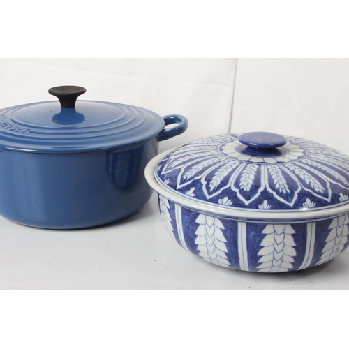 223 - Three pieces of Le Creuset kitchen ware and a blue and white ceramic lidded pot.