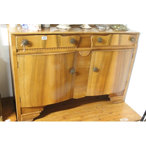 245 - A vintage sideboard with curved panel doors.