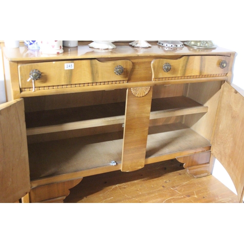 245 - A vintage sideboard with curved panel doors.