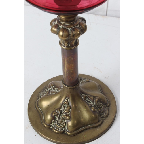 249 - An antique oil lamp with ruby glass font.