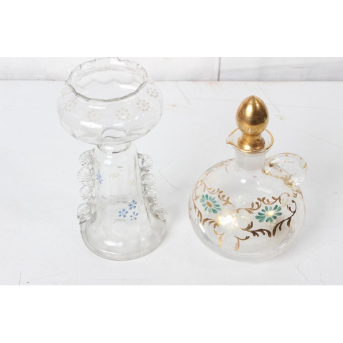 277 - A vintage hand painted decanter and glass set and another.