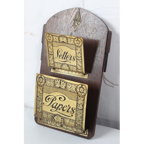 278 - A vintage letter and papers wall rack.