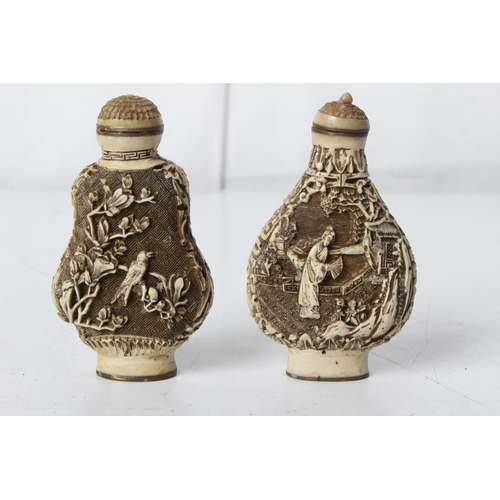 284 - A pair of 2 carved Oriental/ Chinese bottles, signed to base.