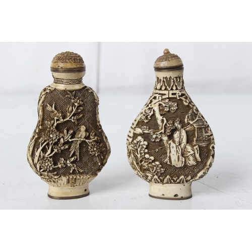 284 - A pair of 2 carved Oriental/ Chinese bottles, signed to base.