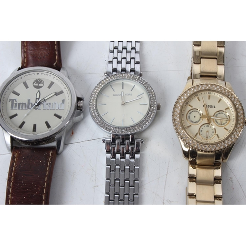 287 - Three replica style watches to include Timberland, Michael Kors and Fossil.