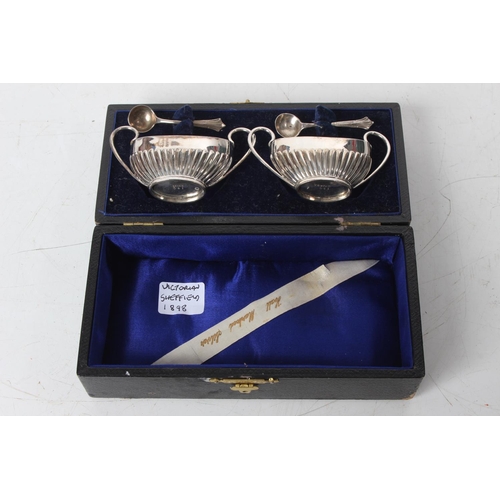 288 - A cased pair of antique Sterling Silver salt pots and spoons, Sheffield 1898.