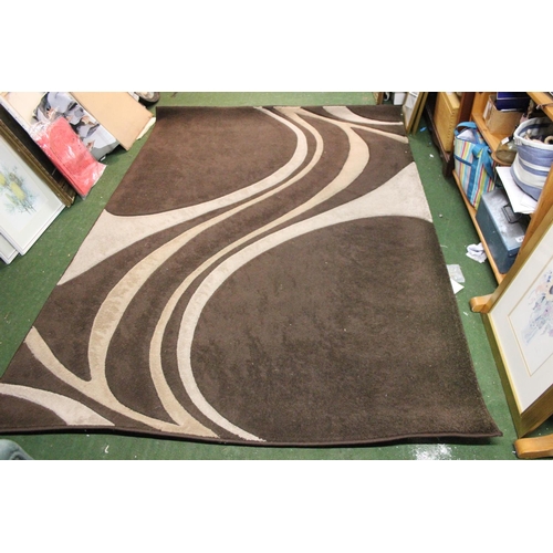 295 - A brown patterned floor rug, measuring 160cm x 230cm.