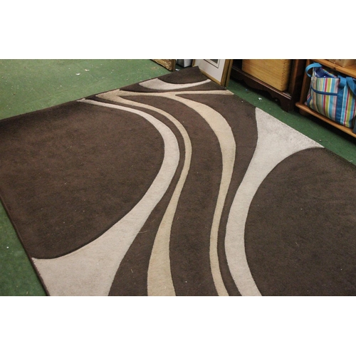 295 - A brown patterned floor rug, measuring 160cm x 230cm.