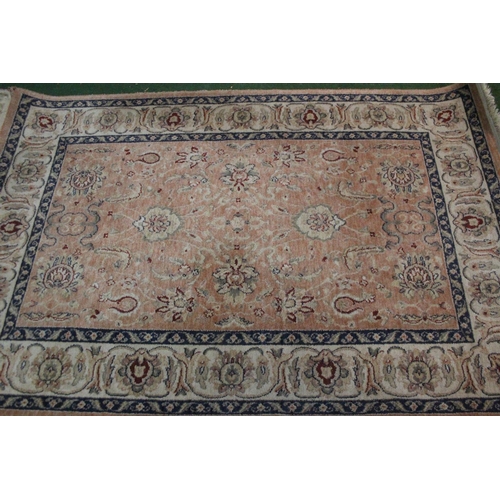 296 - A floral patterned rug, measuring 200cm x 132cm.