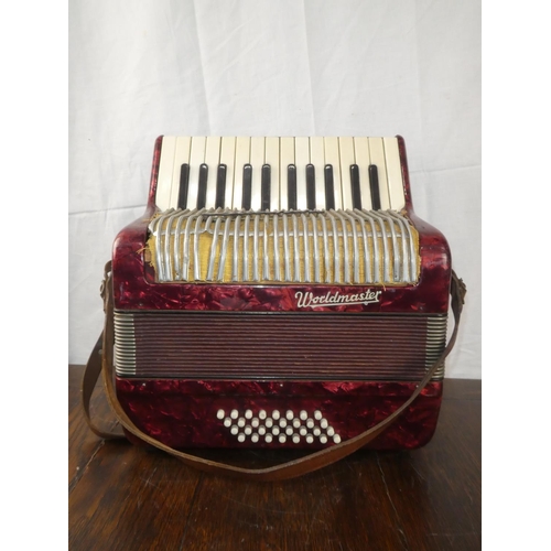 115 - A vintage Worldmaster accordion.