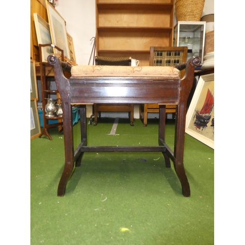 120 - An upholstered piano stool.