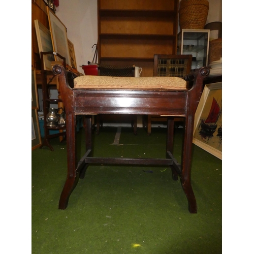 120 - An upholstered piano stool.