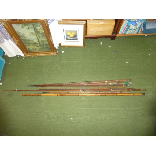 135 - A lot of vintage cane fishing rods.