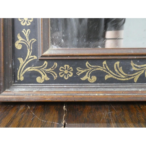 136 - A decorative framed wall mirror.