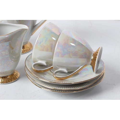 40 - A vintage gilt and pearl patterned coffee set.