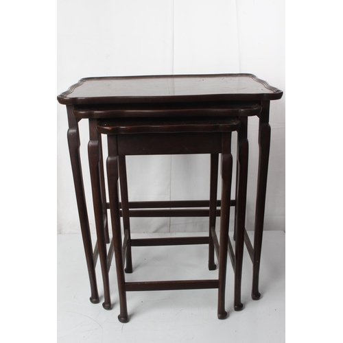 61 - A mahogany nest of three tables.