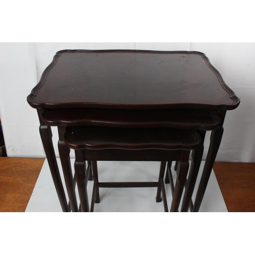 61 - A mahogany nest of three tables.