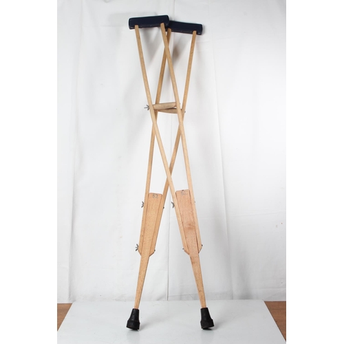 70 - A pair of antique style wooden crutches.