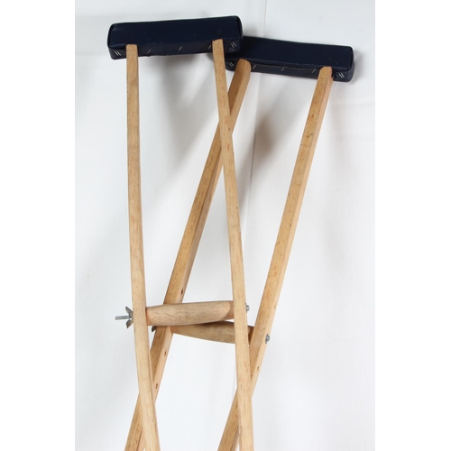 70 - A pair of antique style wooden crutches.