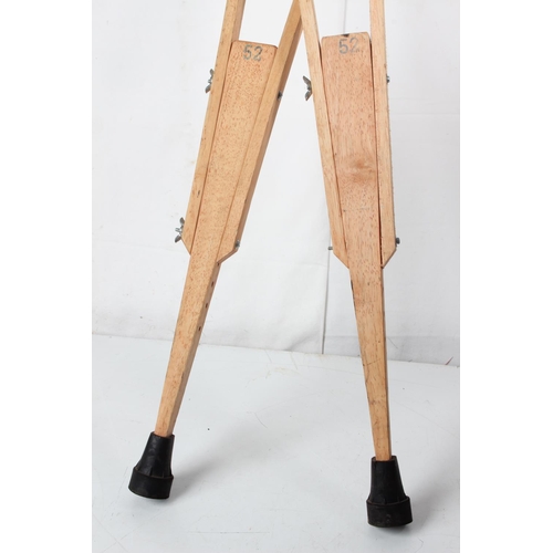 70 - A pair of antique style wooden crutches.