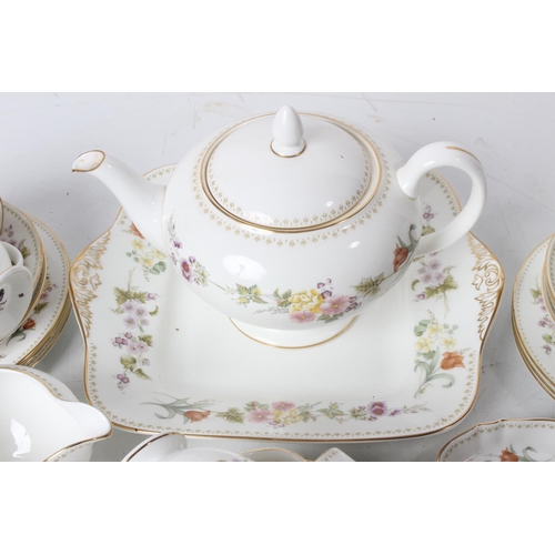 71 - A Wedgwood 'Mirabelle' bone china tea set including teapot, cake plate and lots more.