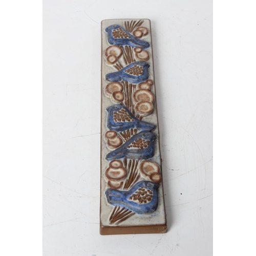 73 - A Marianne Stark pottery wall plaque of birds. 33x8cm.