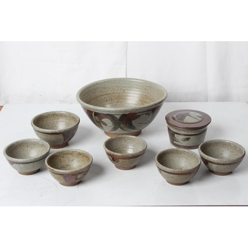 74 - A large vintage studio pottery patterned bowl, a set of five bowls and more.