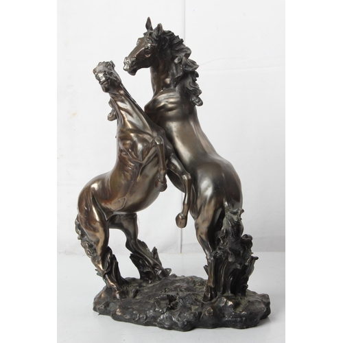 91 - A large ornamental statue of two horses. 44CM.