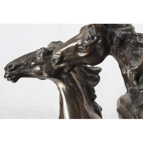 91 - A large ornamental statue of two horses. 44CM.