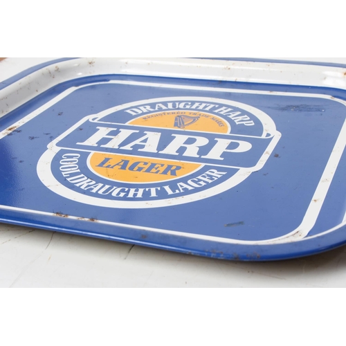 93 - Two vintage Harp Larger pub trays.