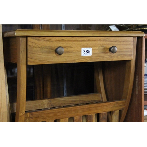 385 - A magazine rack/lamp table.