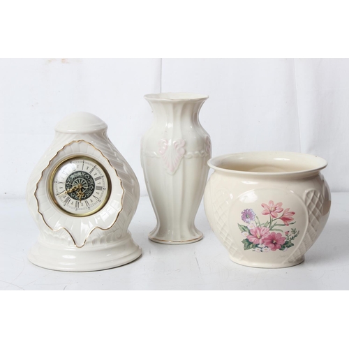 391 - A Royal Winton plant pot, a Belleek mantle clock and vase.