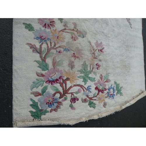 362 - A large floral patterned floor rug, measuring 147 inch x 112 inch.