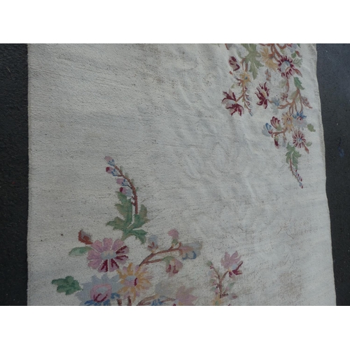 362 - A large floral patterned floor rug, measuring 147 inch x 112 inch.