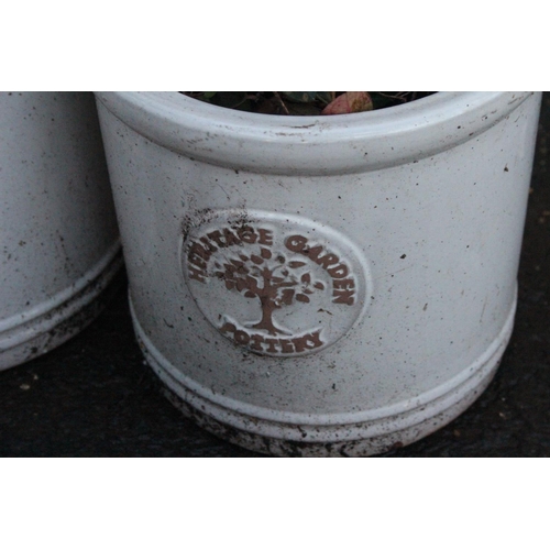 454 - A set of three Heritage Garden Pottery plant pots, measuring 18cm.