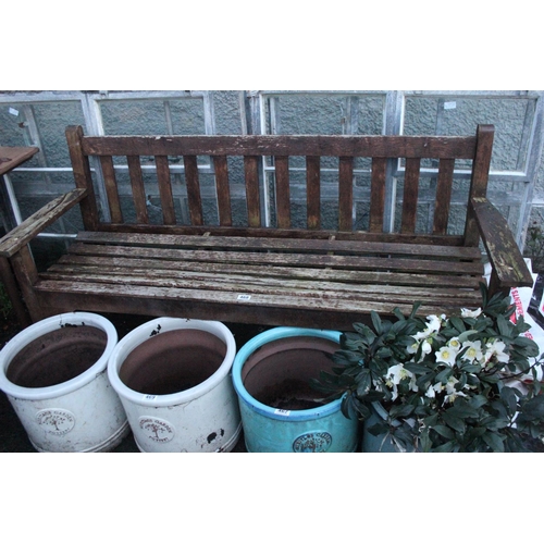 468 - A wooden garden bench.