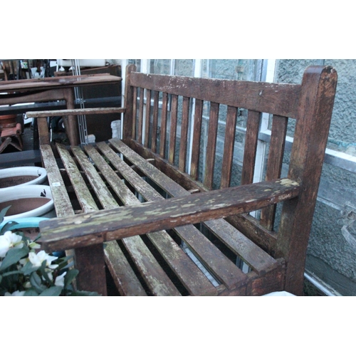 468 - A wooden garden bench.