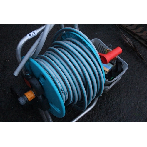 471 - A garden hose and reel and more.