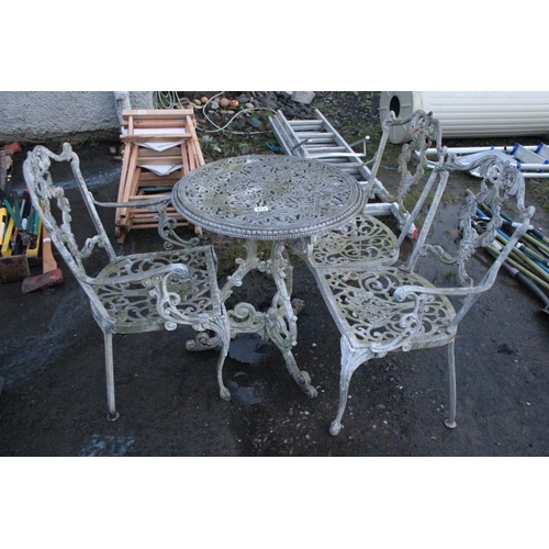 473 - Three piece cast metal garden table and chair set.